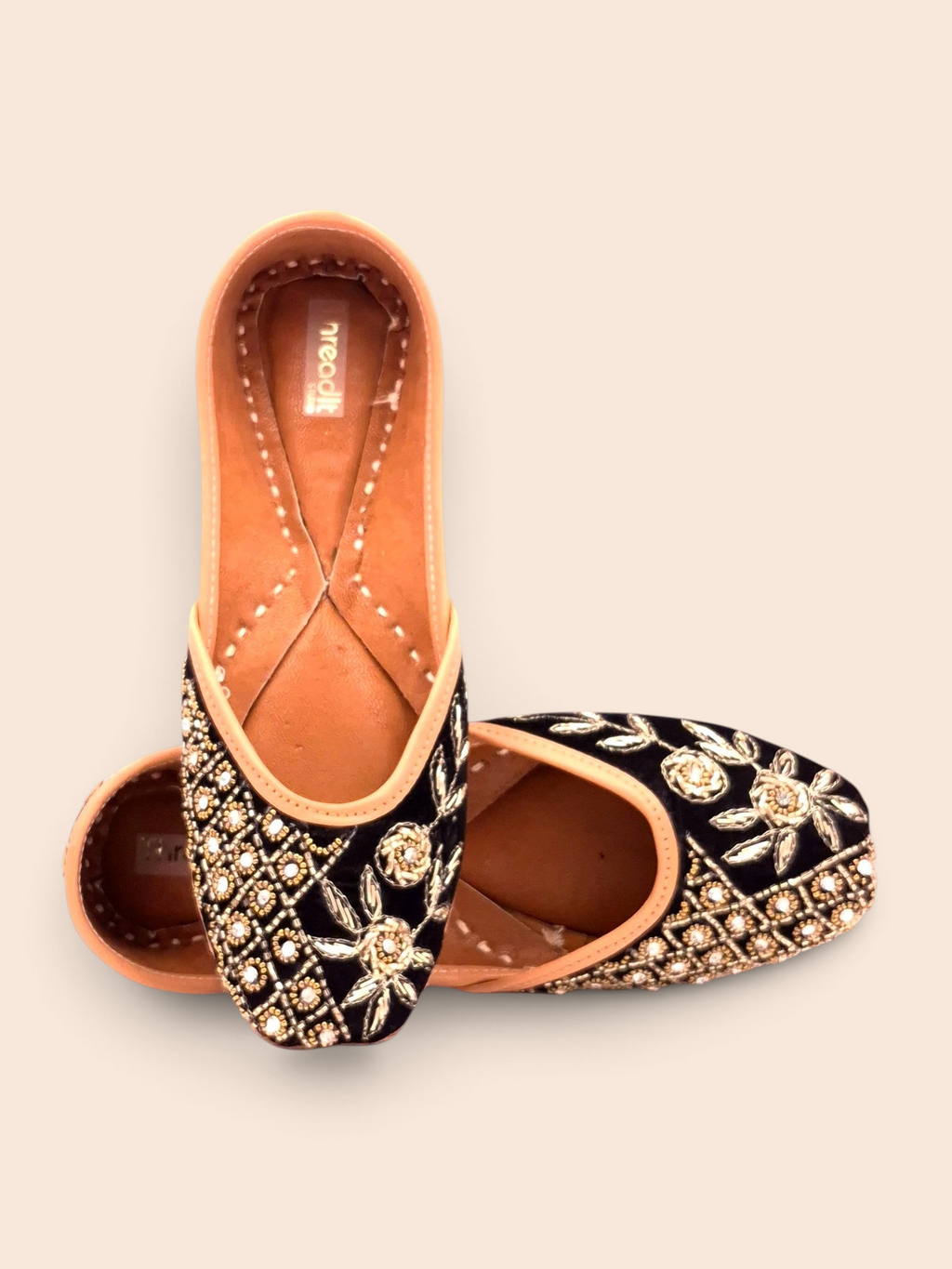 ThreadItStudio handcrafted midnight blue jutti with intricate gold floral embroidery and beadwork for festive wear.