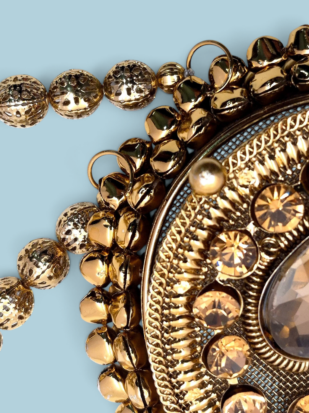 ThreadItStudio Maharani Chaand golden metal clutch with intricate beadwork and crystal embellishments