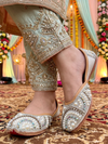 ThreadItStudio silver base jutti featuring intricate multi-color kundan stone and pearl embellishments for bridal wear
