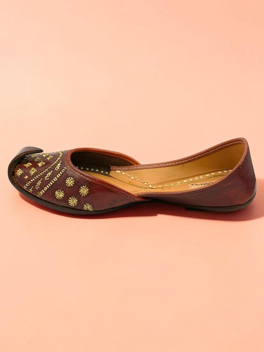 ThreadItStudio brown leather jutti with gold floral embroidery and traditional curved toe for ethnic wear