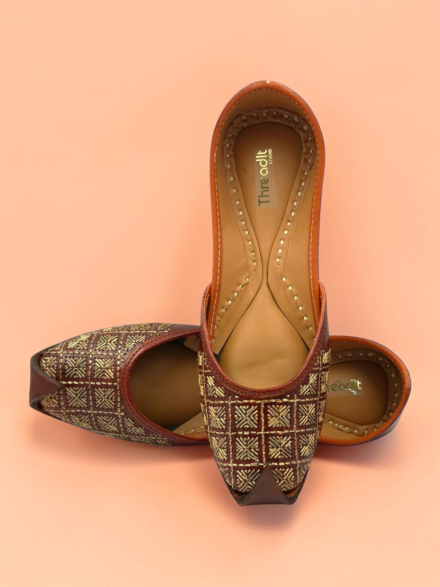 ThreadItStudio Rang Punjab brown leather juttis with intricate gold-thread grid embroidery and curved toe design
