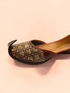ThreadItStudio Rang Punjab brown leather juttis with intricate gold-thread grid embroidery and classic curved toe.