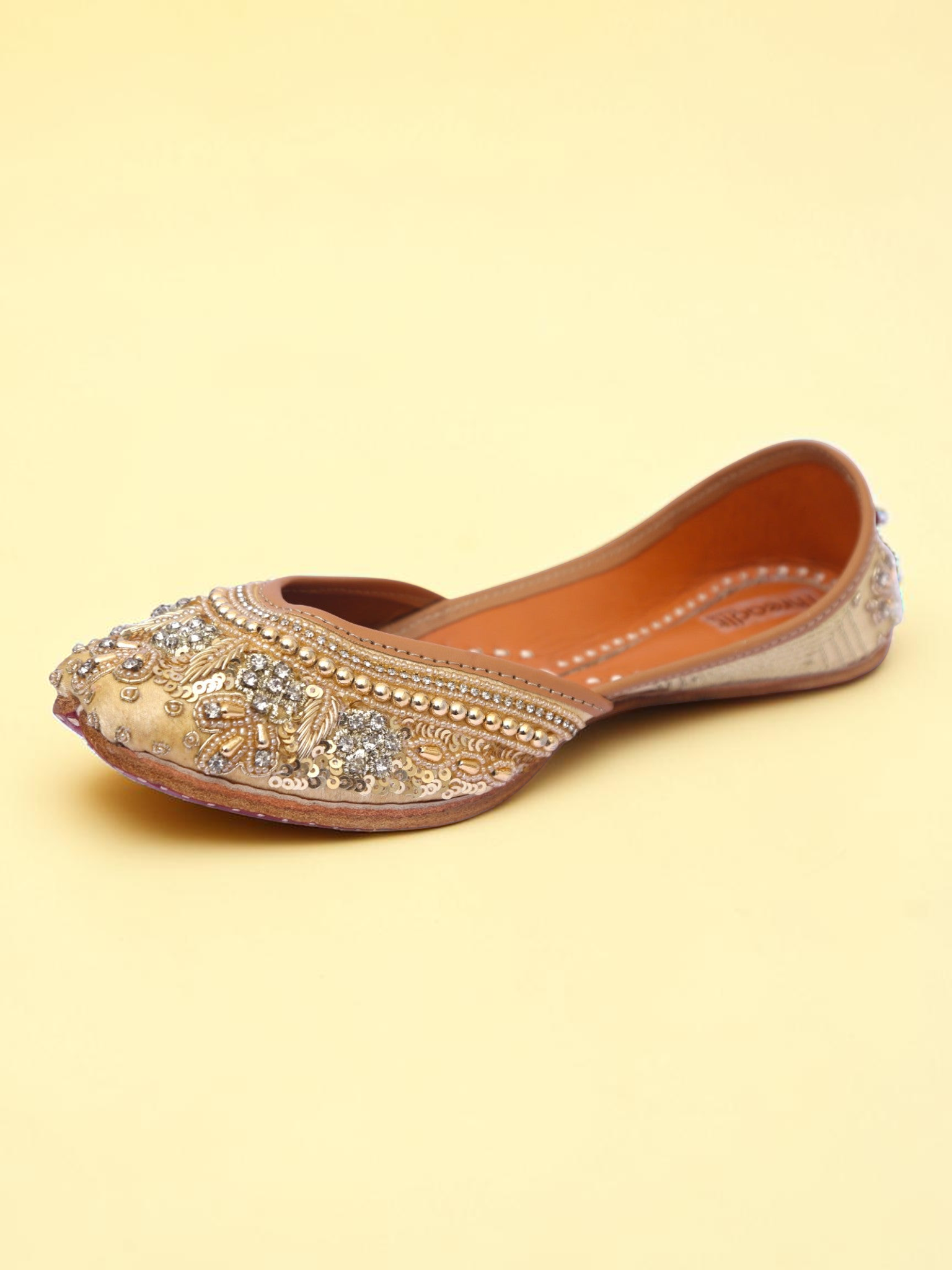 ThreadItStudio golden jutti featuring intricate pearl and sequin embroidery for traditional ethnic wear
