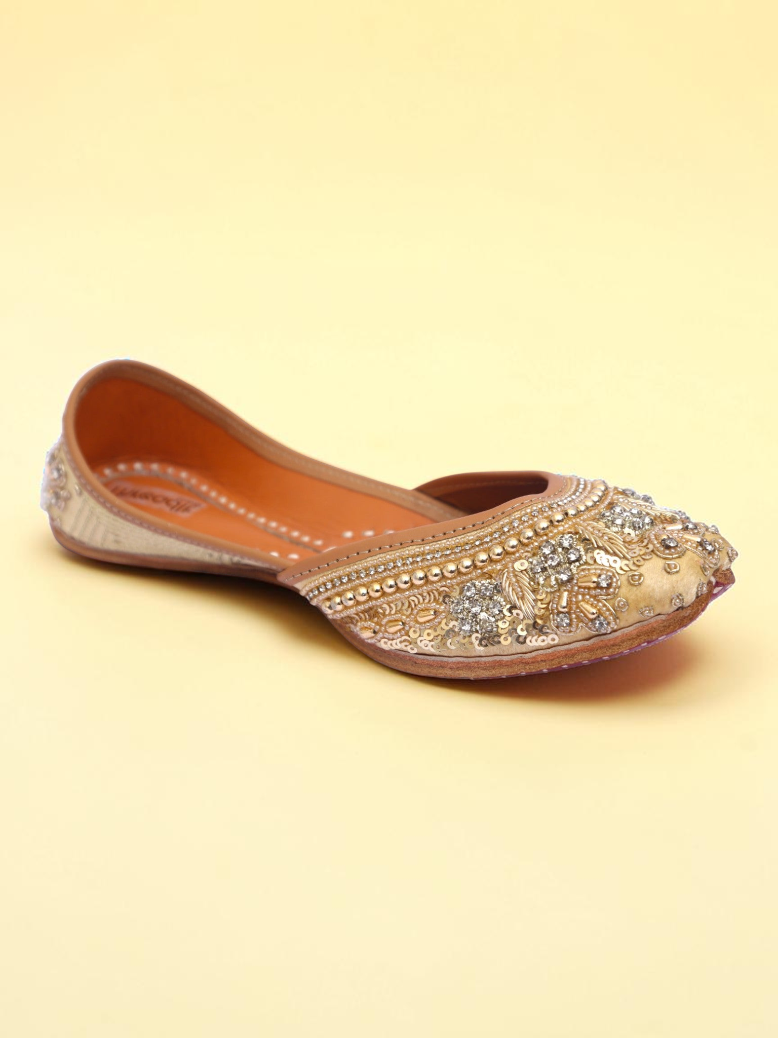 ThreadItStudio golden jutti featuring intricate pearl and sequin embroidery for traditional ethnic wear.