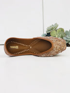ThreadItStudio handcrafted brown jutti with intricate vintage gilt embroidery and beadwork on a white background