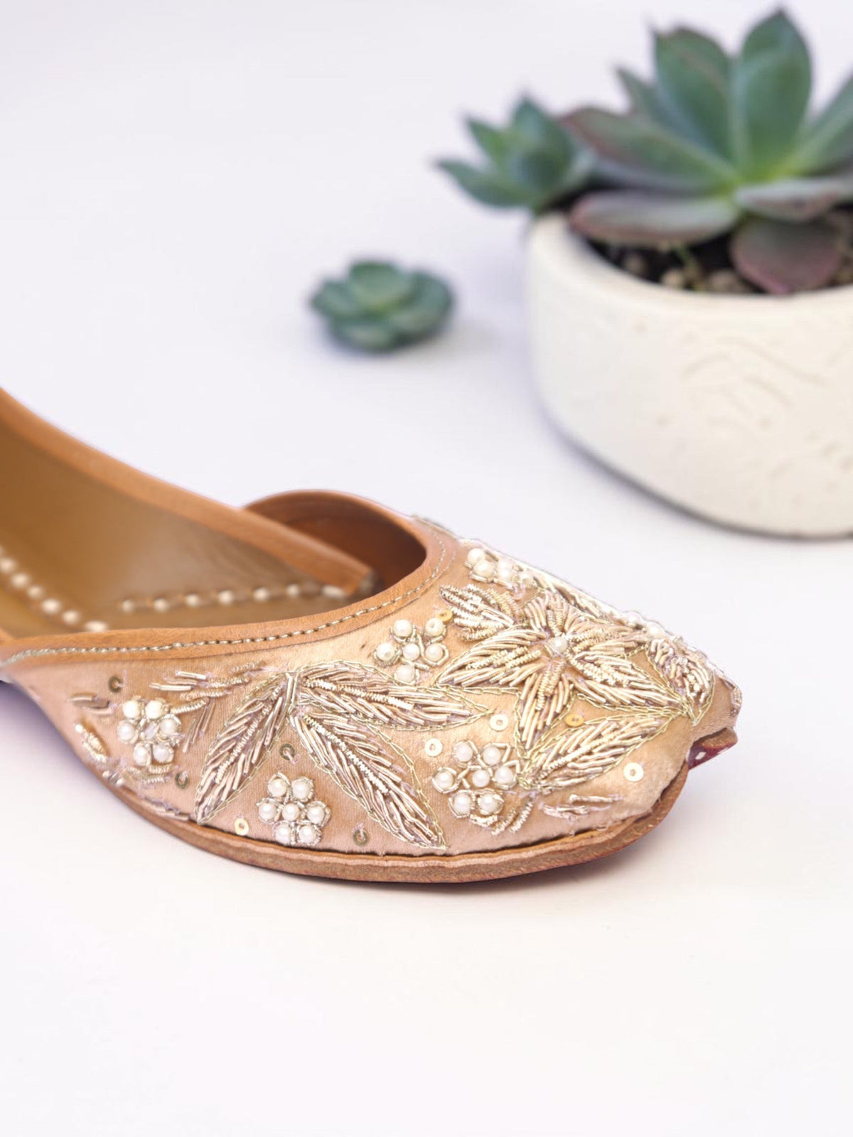 ThreadItStudio handcrafted Shahi jutti in beige with intricate vintage gilt embroidery, pearls, and sequin detailing.