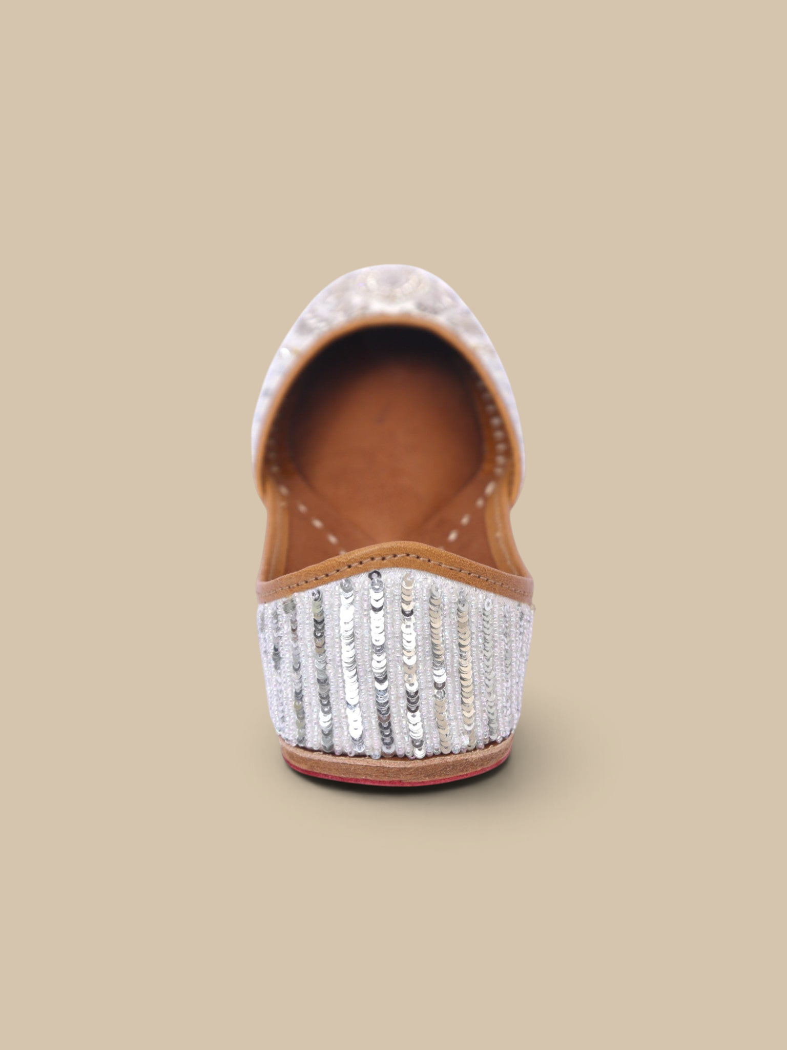 ThreadItStudio Ivory Virasat handcrafted juttis featuring intricate silver sequin embroidery and floral detailing.