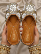 ThreadItStudio handcrafted ethnic jutti featuring intricate gold and white kundan beadwork on a metallic base.