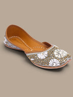 ThreadItStudio handcrafted ethnic jutti featuring intricate white and gold kundan beadwork for festive occasions.