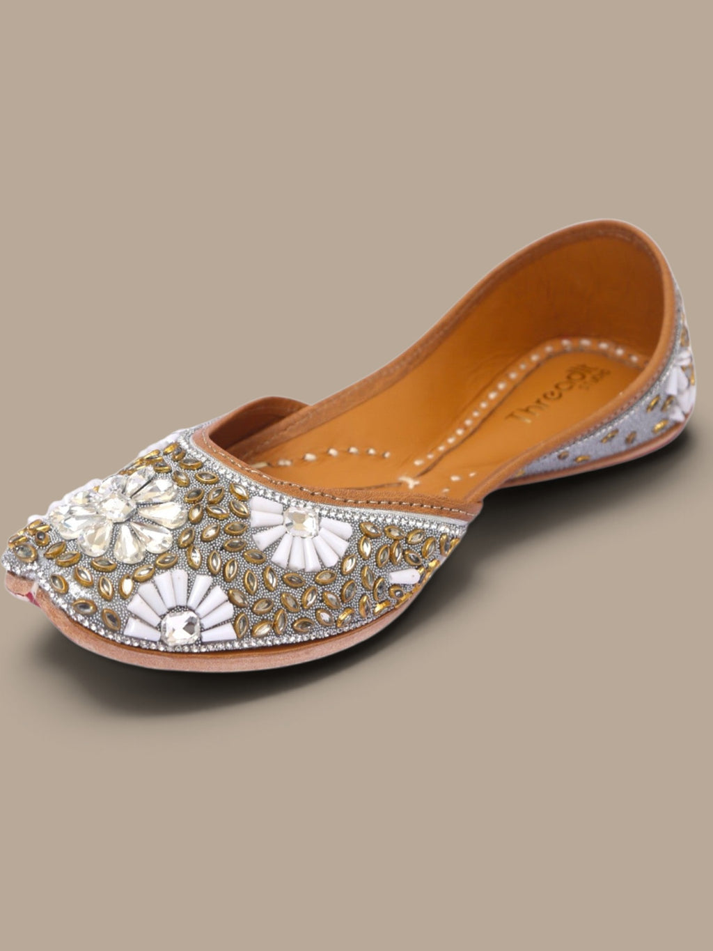 ThreadItStudio handcrafted ethnic jutti featuring intricate silver and gold kundan beadwork for festive occasions.