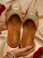 ThreadItStudio handcrafted ethnic jutti featuring intricate gold kundan beadwork and floral patterns for festive wear.