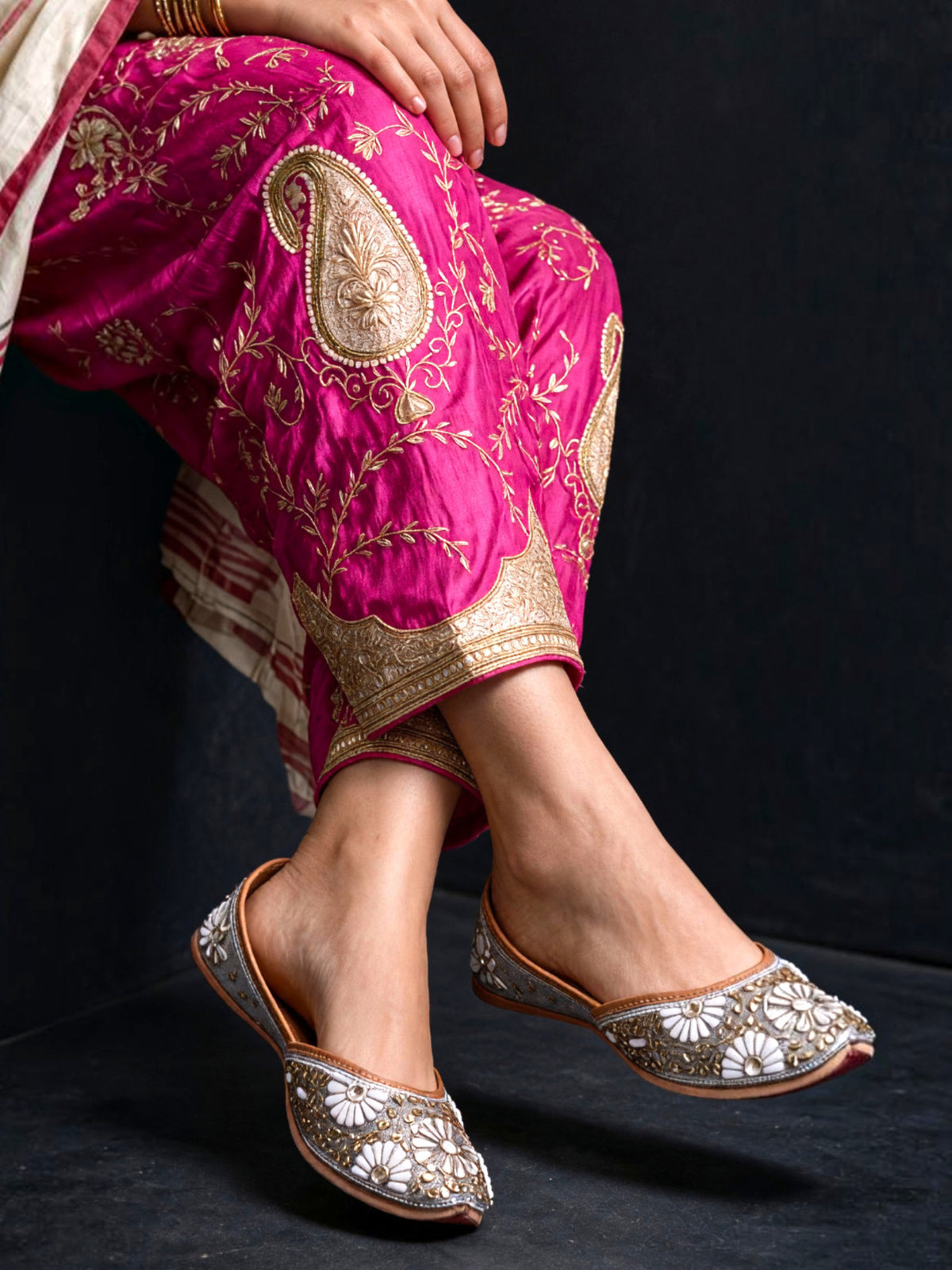 ThreadItStudio ethnic jutti featuring intricate white and gold kundan beadwork on a grey base for festive wear