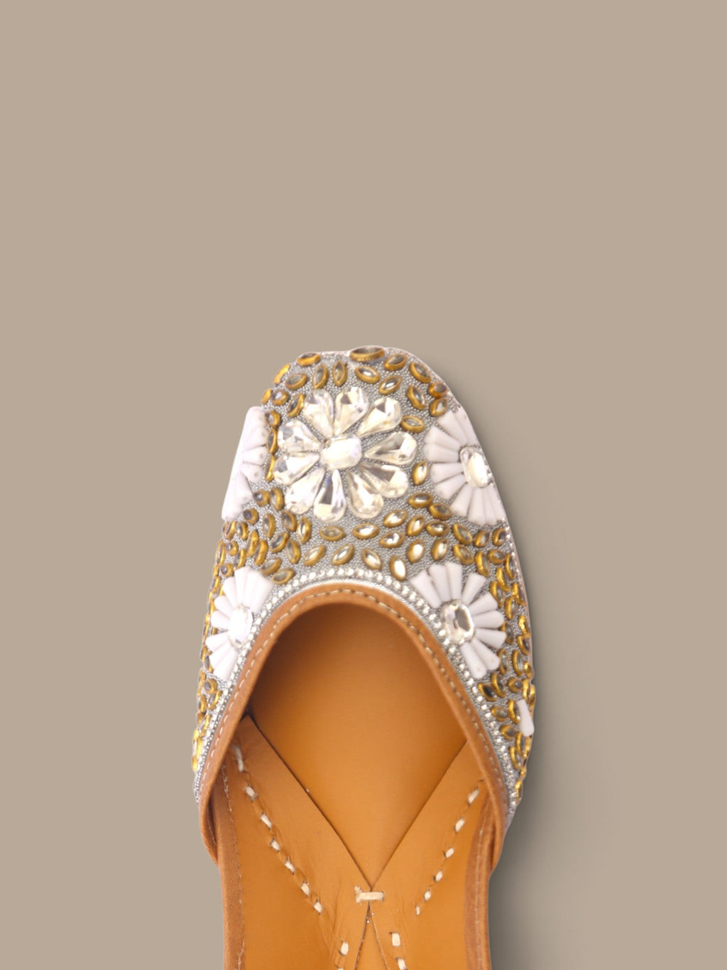 ThreadItStudio ethnic jutti featuring intricate gold and white kundan beadwork on a tan leather base