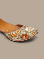 ThreadItStudio handcrafted ethnic jutti with intricate gold kundan beadwork and floral embellishments for weddings.