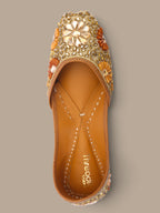 ThreadItStudio ethnic jutti in gold with intricate kundan beadwork and floral accents for weddings and festivals.