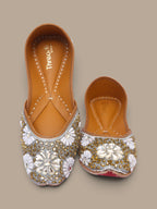 ThreadItStudio handcrafted ethnic jutti with intricate white and gold kundan beadwork for weddings and festivals.