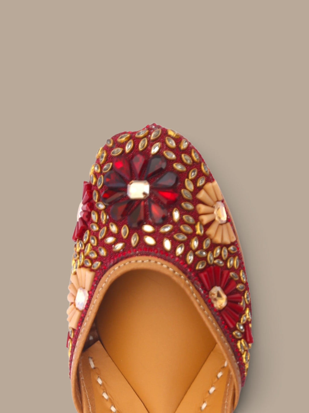ThreadItStudio maroon ethnic jutti featuring intricate kundan beadwork and floral stone embellishments for weddings.