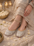 ThreadItStudio silver handcrafted jutti with intricate embroidery and pearl detailing worn with bridal attire