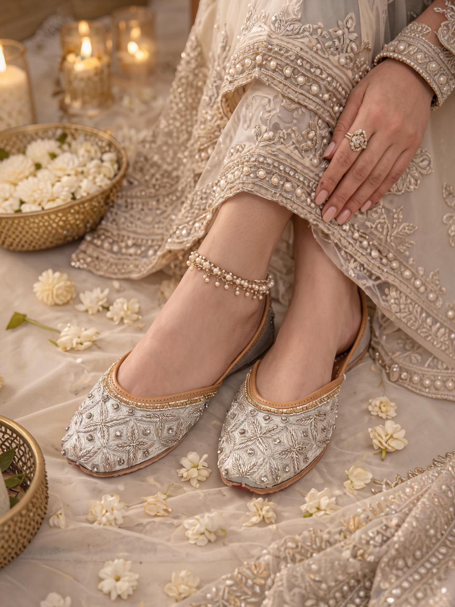 ThreadItStudio silver handcrafted jutti with intricate embroidery and pearl detailing worn with bridal attire