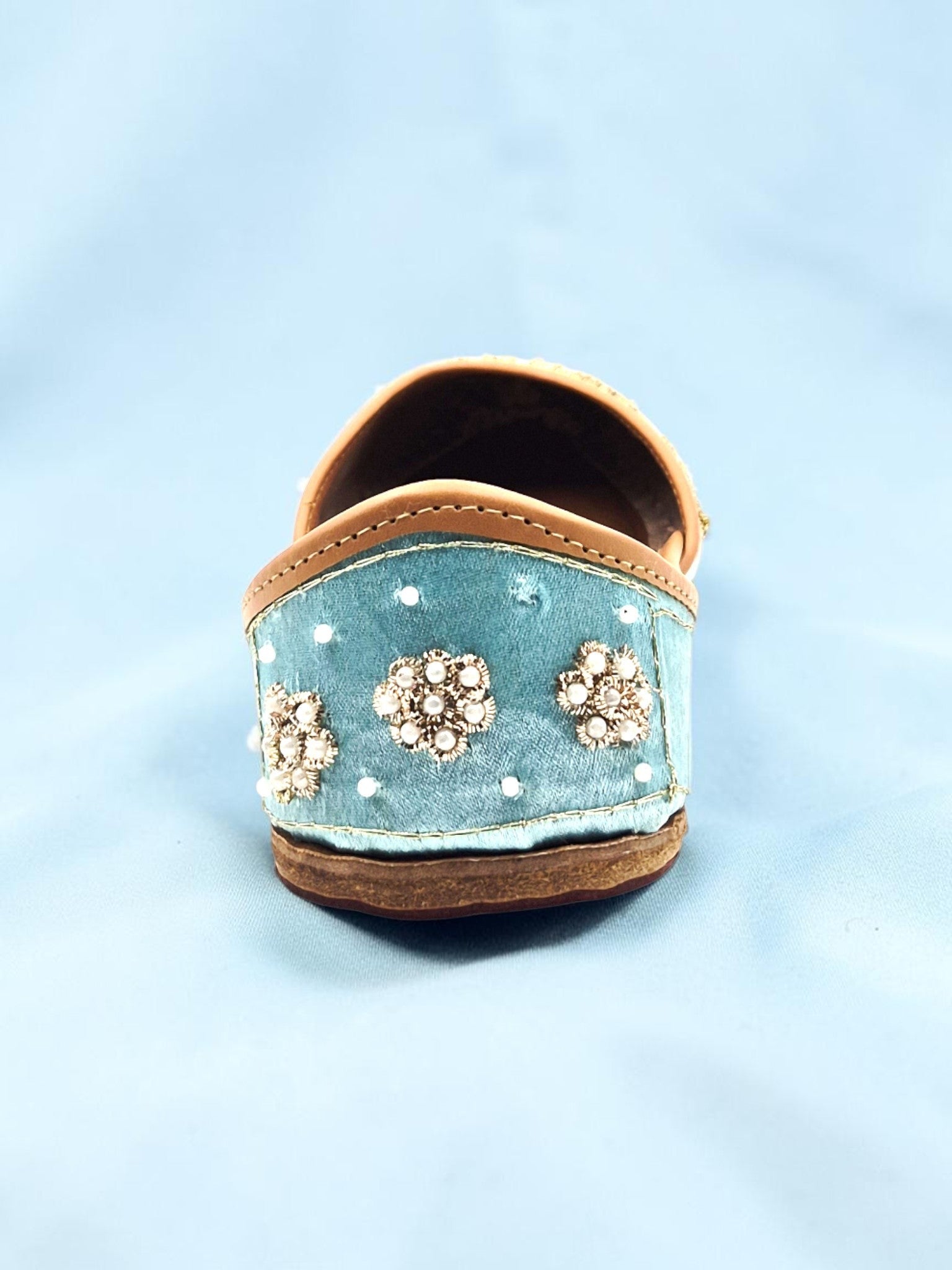 ThreadItStudio handcrafted sky blue ethnic jutti with intricate floral embroidery and pearl detailing on velvet fabric