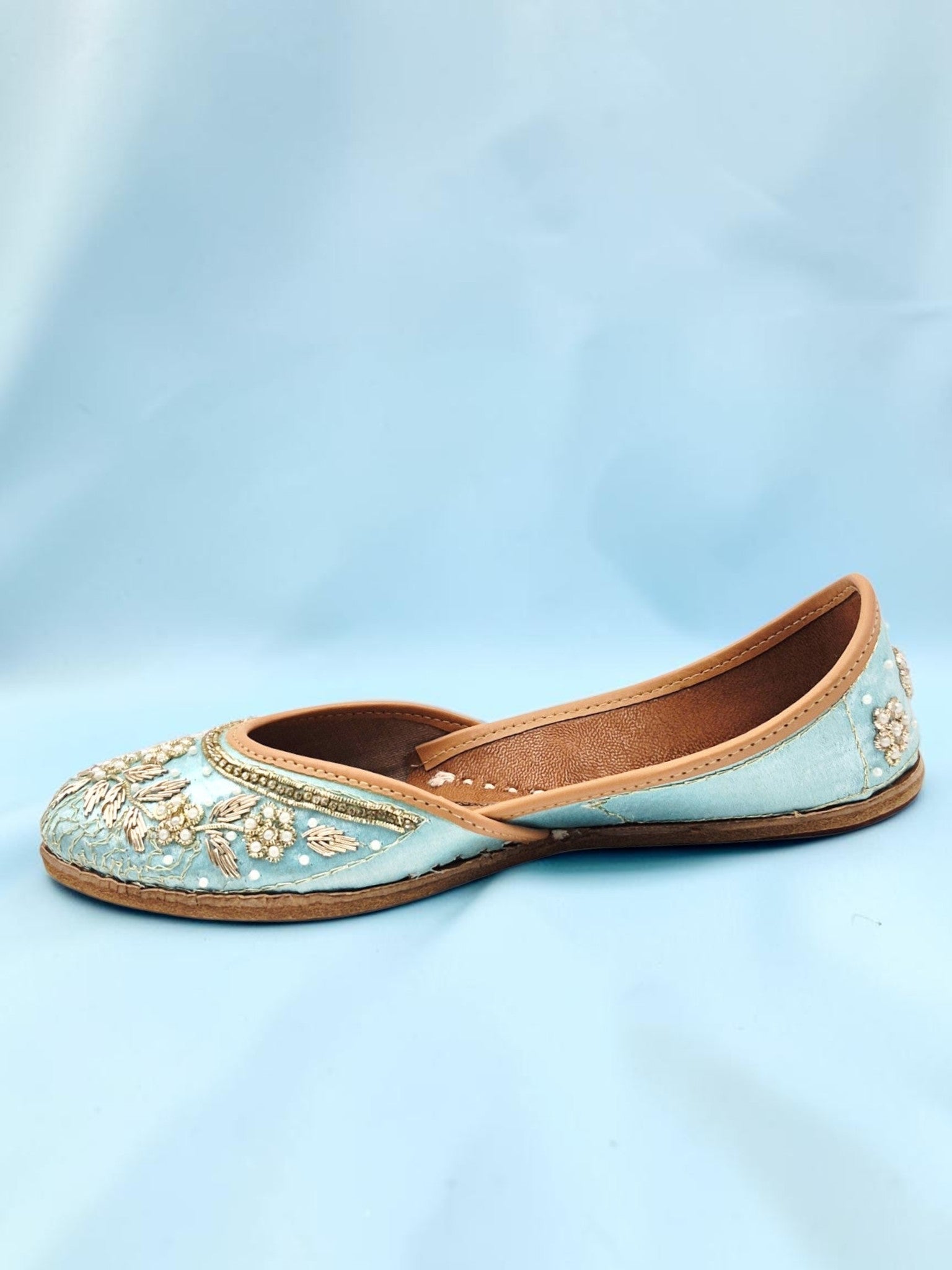 ThreadItStudio sky blue handcrafted ethnic jutti with intricate gold floral embroidery and traditional slip-on design