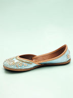 ThreadItStudio handcrafted sky blue ethnic jutti with intricate gold floral embroidery and traditional detailing.