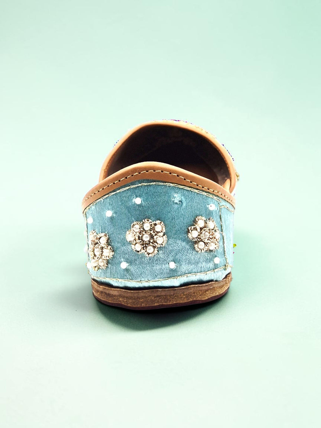 ThreadItStudio sky blue handcrafted ethnic jutti with intricate floral beadwork and embroidery on a soft fabric base